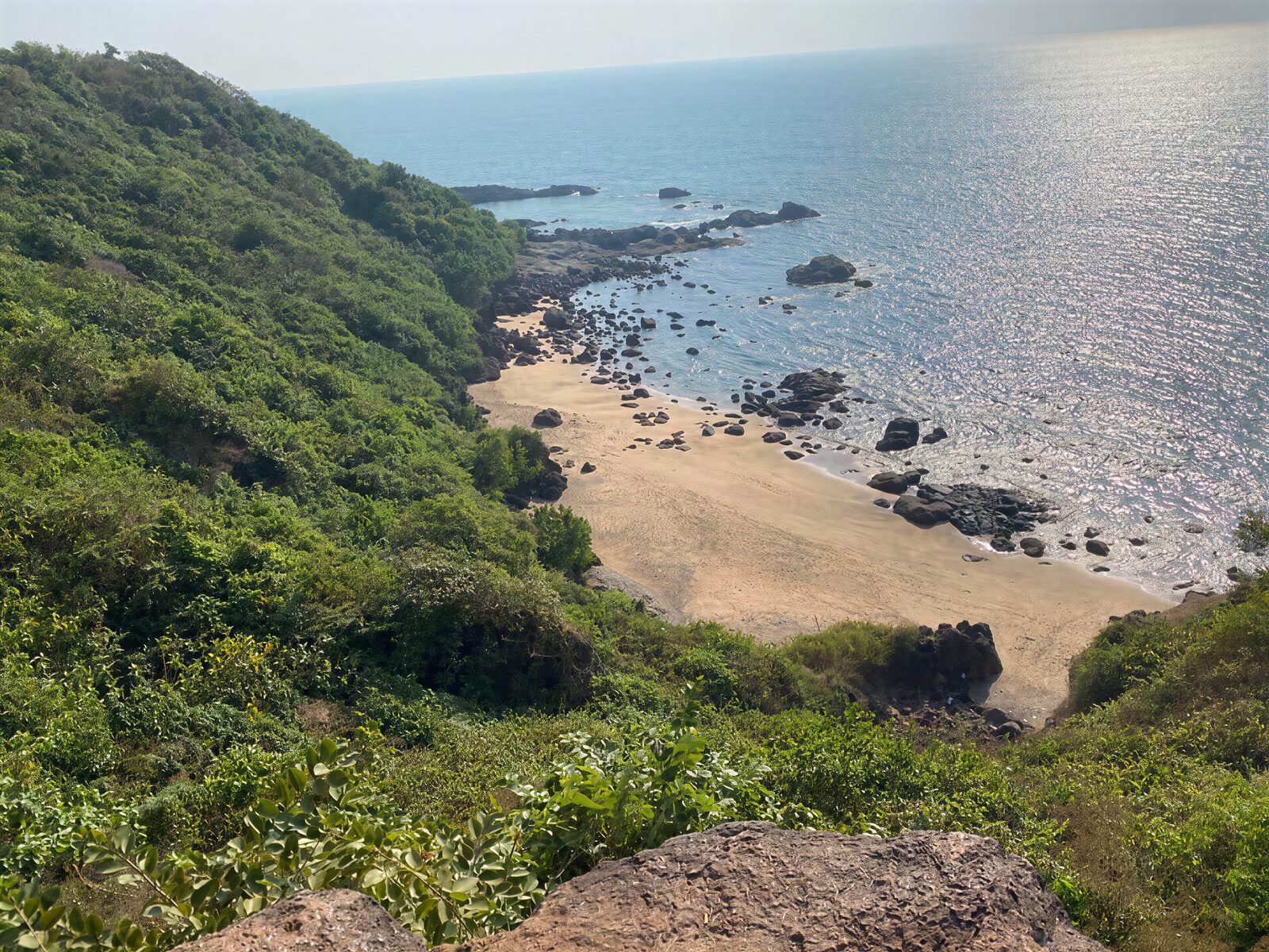 A small rocky cove seen from the nature trail at Cola Beach